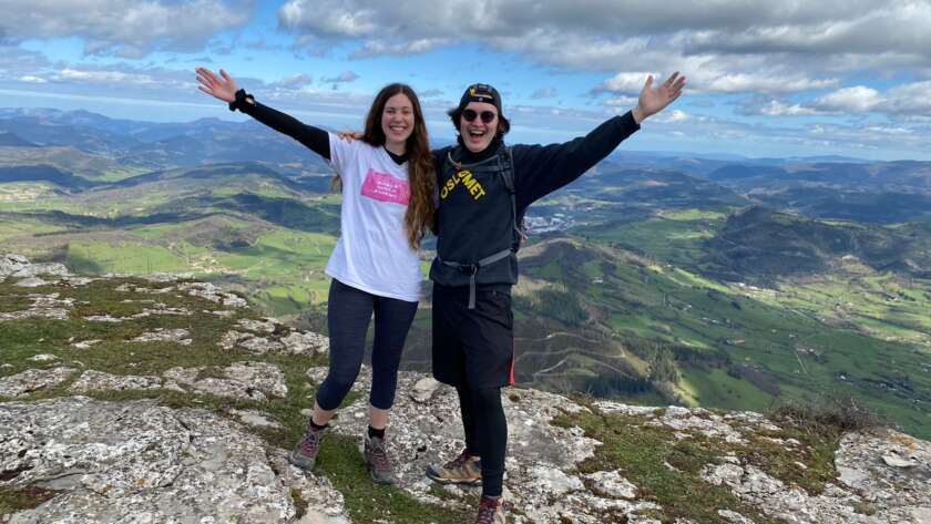 two friends on the top of a mountain in Spain