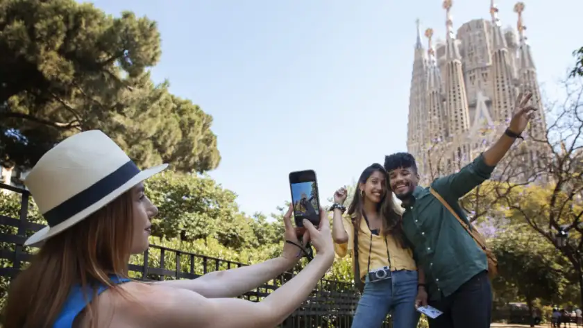 side view woman taking photos with phone scaled.jpg